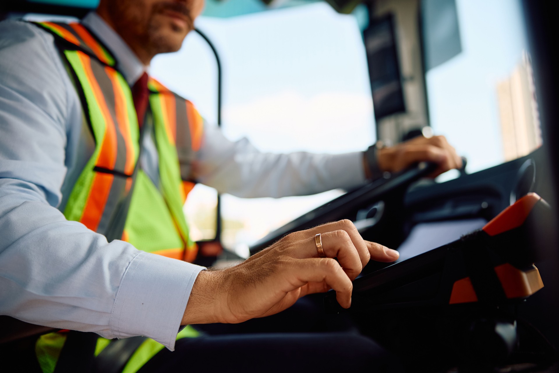 Close up of bus driver selling a ticket.